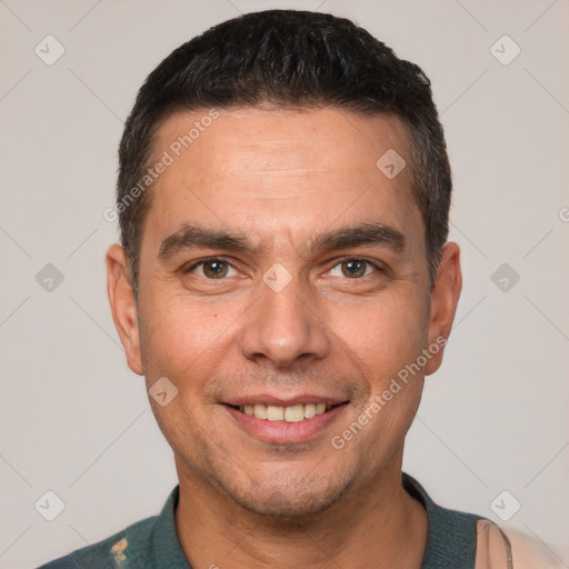 Joyful white adult male with short  brown hair and brown eyes