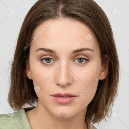 Neutral white young-adult female with medium  brown hair and green eyes