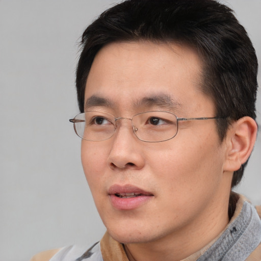Neutral asian young-adult male with short  brown hair and brown eyes