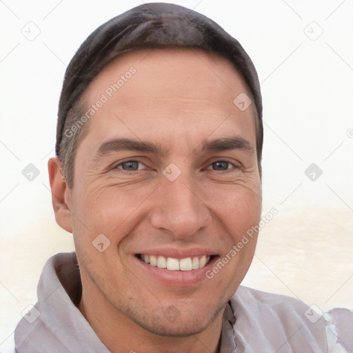 Joyful white adult male with short  brown hair and brown eyes