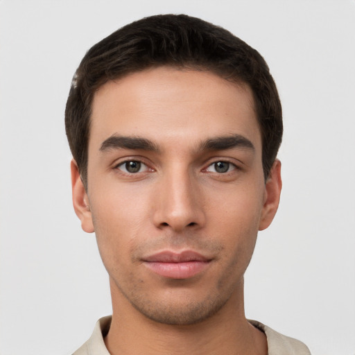 Neutral white young-adult male with short  brown hair and brown eyes