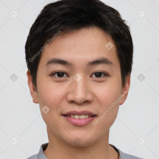 Joyful asian young-adult male with short  brown hair and brown eyes