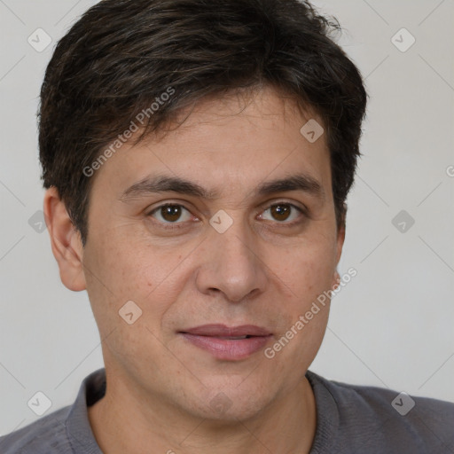 Joyful white adult male with short  brown hair and brown eyes