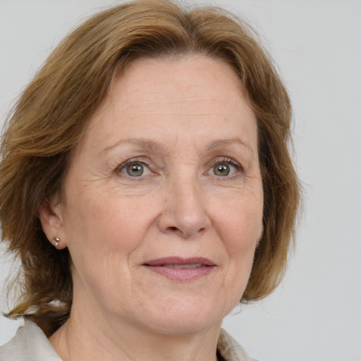 Joyful white middle-aged female with medium  brown hair and brown eyes