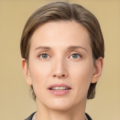 Joyful white young-adult female with medium  brown hair and grey eyes