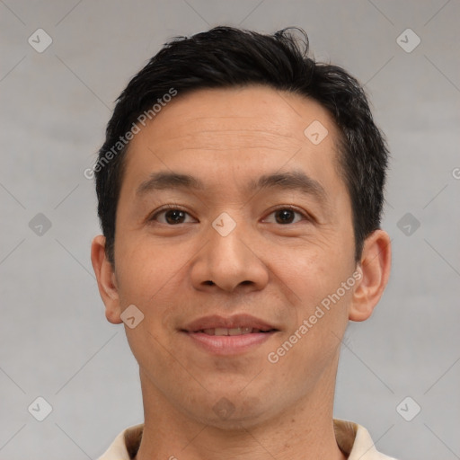 Joyful white adult male with short  brown hair and brown eyes