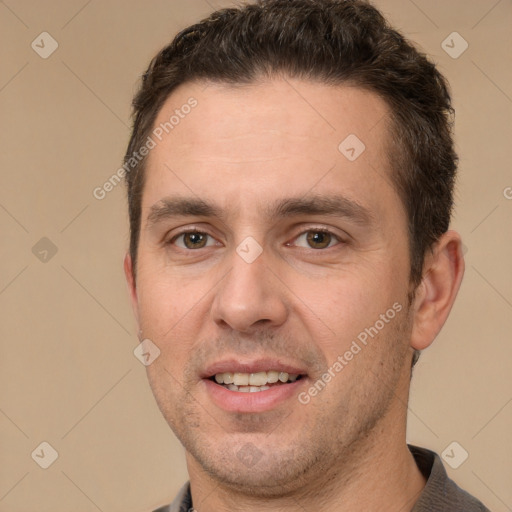 Joyful white adult male with short  brown hair and brown eyes