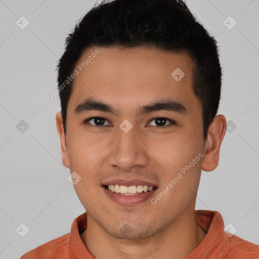 Joyful latino young-adult male with short  brown hair and brown eyes