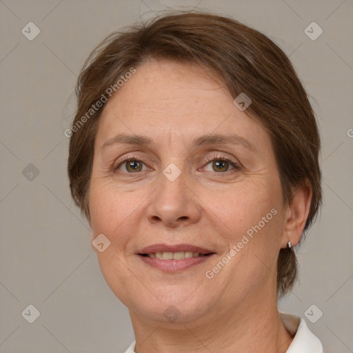 Joyful white adult female with medium  brown hair and green eyes