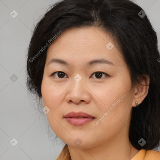 Joyful asian young-adult female with medium  brown hair and brown eyes