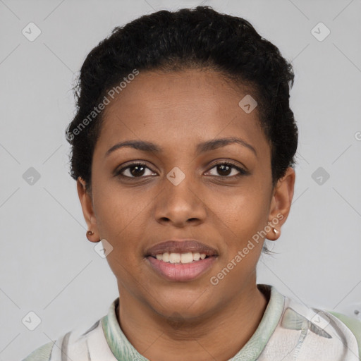 Joyful black young-adult female with short  black hair and brown eyes