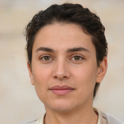 Joyful white young-adult female with short  brown hair and brown eyes