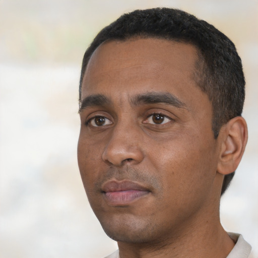 Neutral black young-adult male with short  black hair and brown eyes
