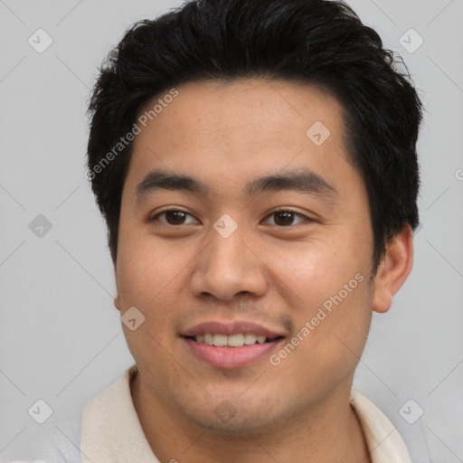 Joyful asian young-adult male with short  brown hair and brown eyes