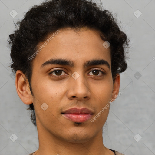 Joyful latino young-adult male with short  brown hair and brown eyes