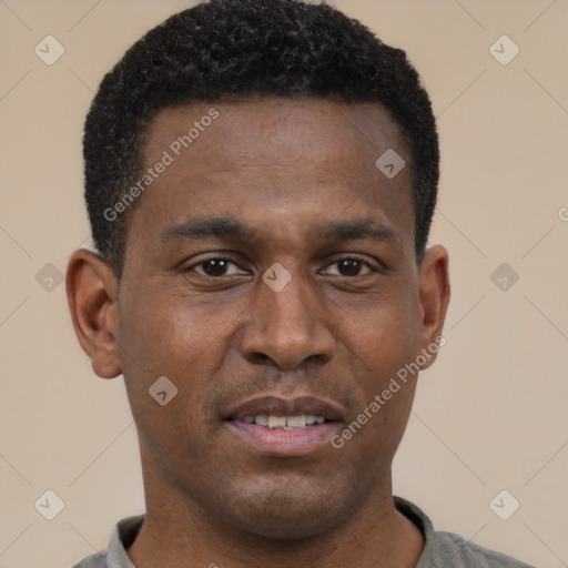 Joyful black young-adult male with short  black hair and brown eyes