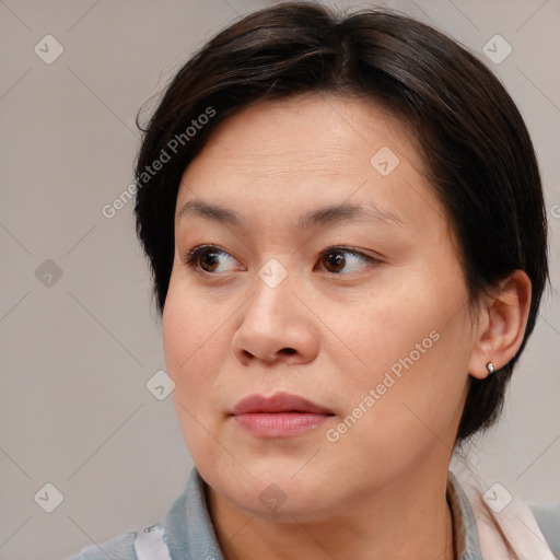 Joyful white adult female with medium  brown hair and brown eyes