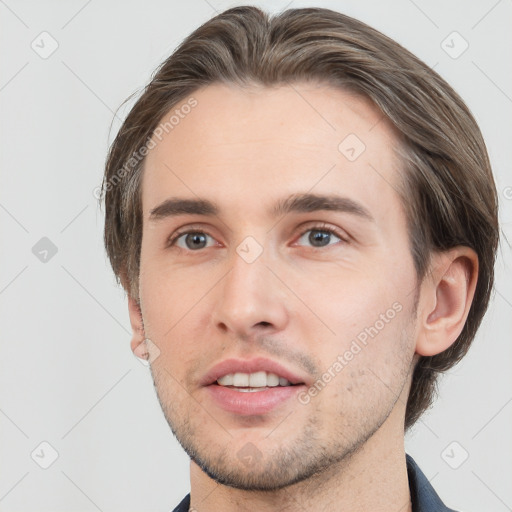 Neutral white young-adult male with short  brown hair and brown eyes