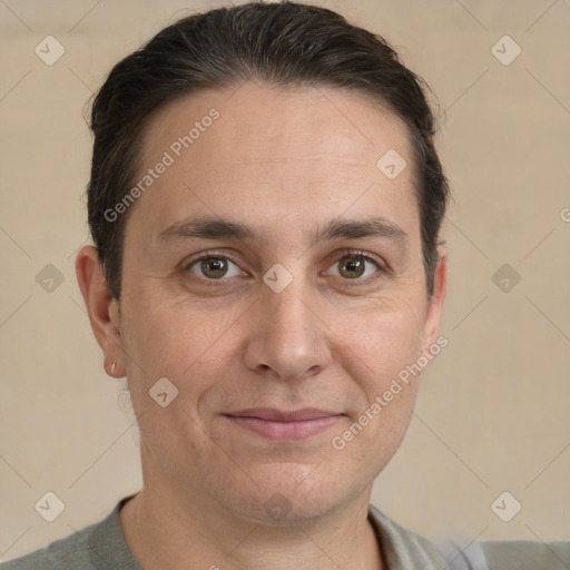 Joyful white adult male with short  brown hair and brown eyes