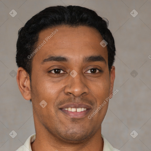 Joyful latino young-adult male with short  brown hair and brown eyes