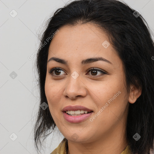 Joyful latino young-adult female with long  brown hair and brown eyes