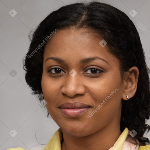 Joyful black young-adult female with medium  brown hair and brown eyes