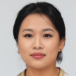 Joyful asian young-adult female with medium  black hair and brown eyes