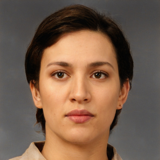 Neutral white young-adult female with short  brown hair and brown eyes