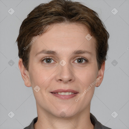 Joyful white young-adult female with short  brown hair and grey eyes