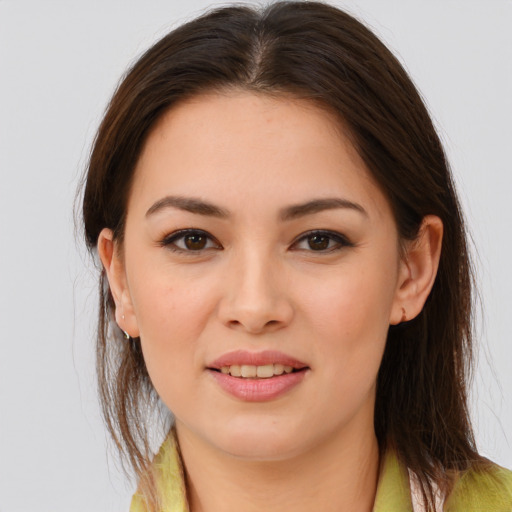 Joyful white young-adult female with long  brown hair and brown eyes