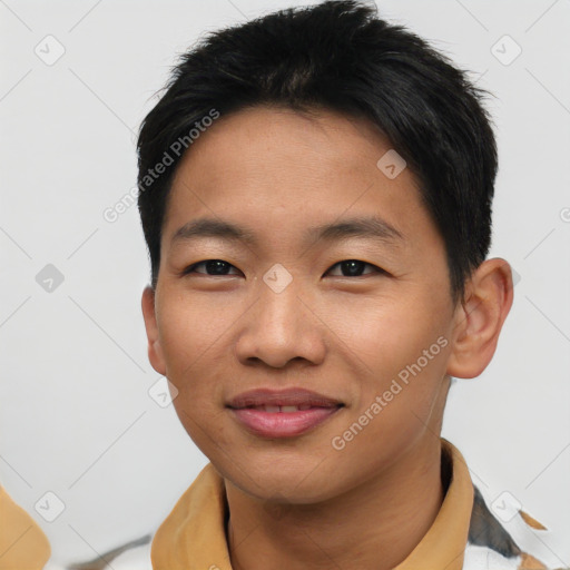 Joyful asian young-adult male with short  black hair and brown eyes