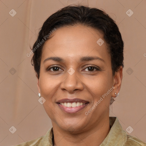 Joyful latino young-adult female with long  brown hair and brown eyes