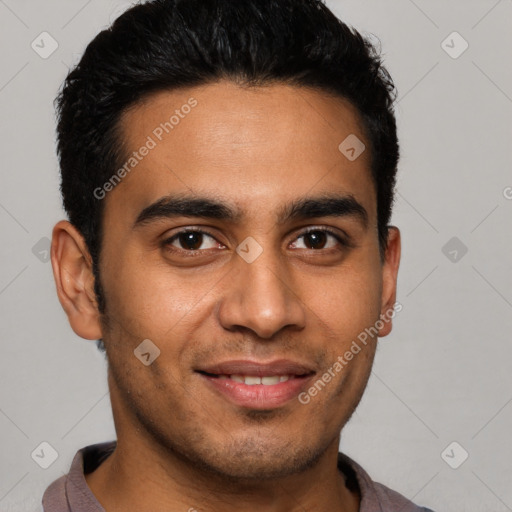 Joyful latino young-adult male with short  brown hair and brown eyes