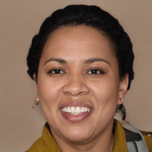 Joyful latino adult female with short  black hair and brown eyes