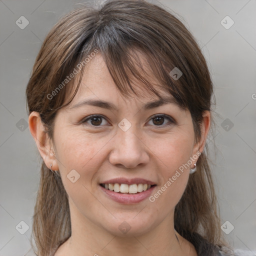 Joyful white adult female with medium  brown hair and grey eyes