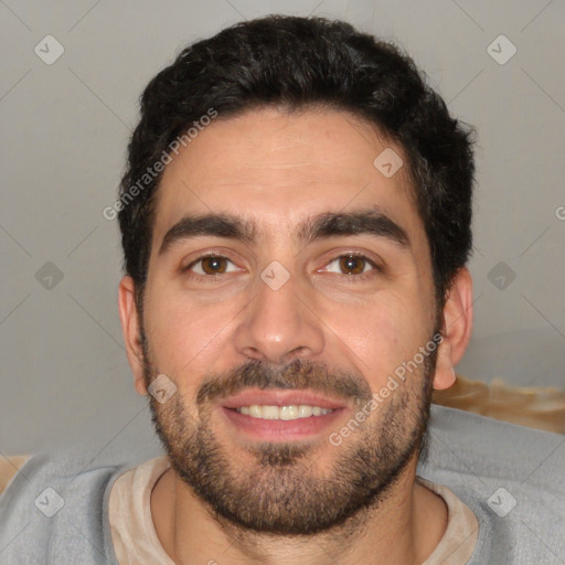 Joyful white young-adult male with short  black hair and brown eyes