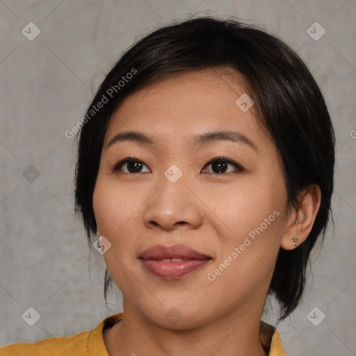 Joyful asian young-adult female with medium  black hair and brown eyes