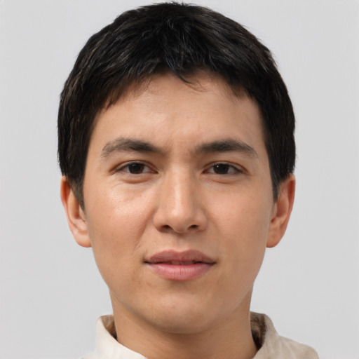 Joyful asian young-adult male with short  brown hair and brown eyes