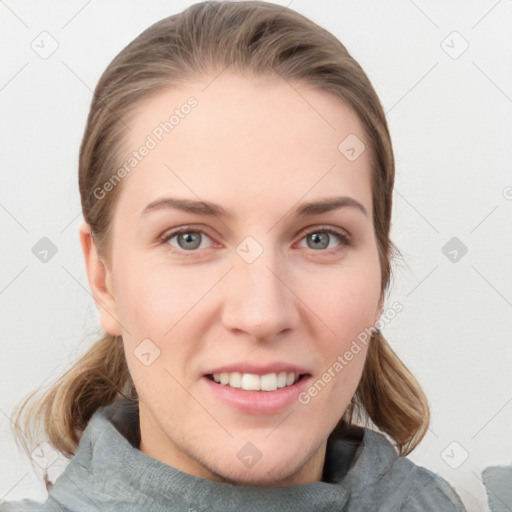 Joyful white young-adult female with medium  brown hair and blue eyes