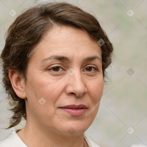 Joyful white adult female with medium  brown hair and green eyes