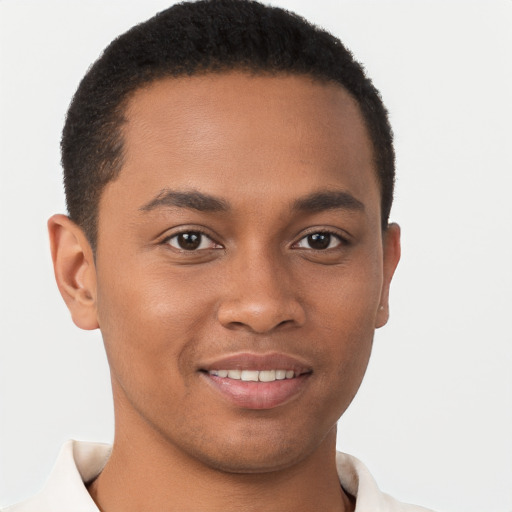 Joyful black young-adult male with short  brown hair and brown eyes