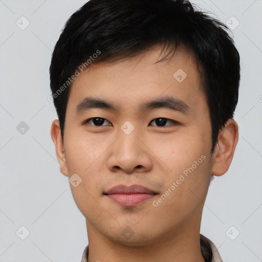 Joyful asian young-adult male with short  black hair and brown eyes