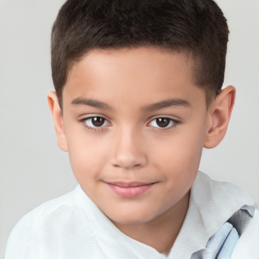 Joyful white child male with short  brown hair and brown eyes