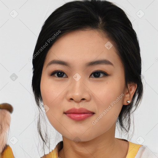 Joyful asian young-adult female with medium  black hair and brown eyes