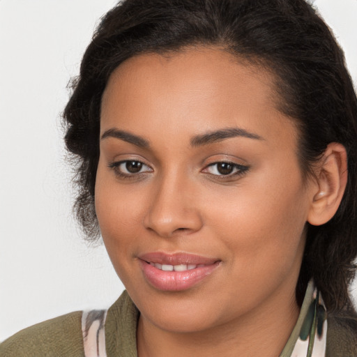 Joyful latino young-adult female with medium  brown hair and brown eyes