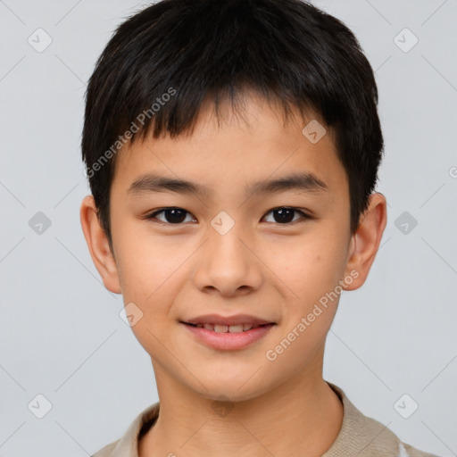 Joyful asian child male with short  brown hair and brown eyes