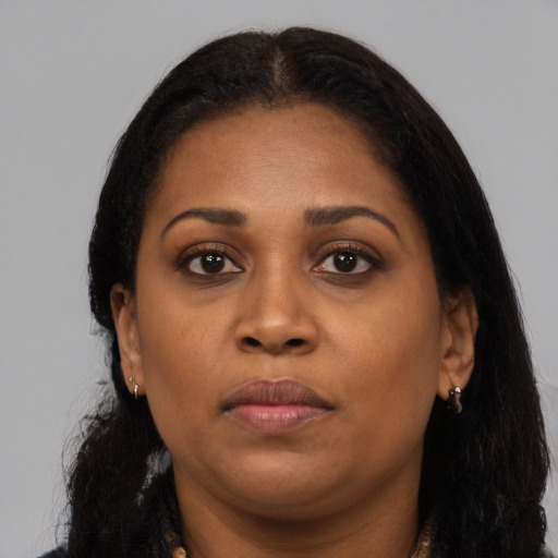 Neutral black young-adult female with long  brown hair and brown eyes