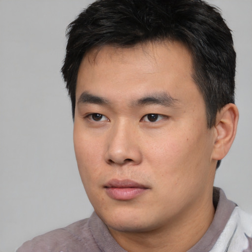 Neutral asian young-adult male with short  black hair and brown eyes