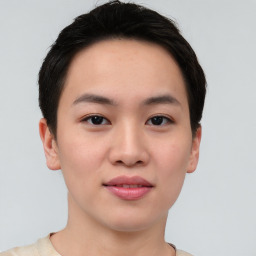 Joyful asian young-adult female with short  brown hair and brown eyes