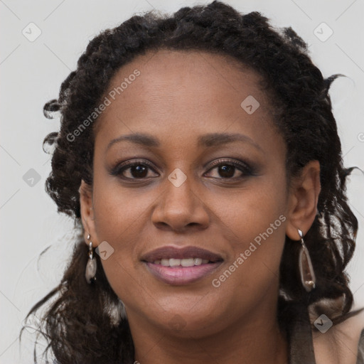 Joyful black young-adult female with long  brown hair and brown eyes